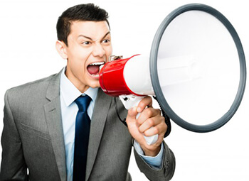 businessman shouting on the megaphone